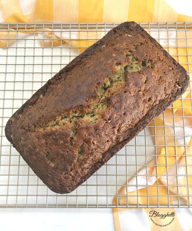Baked loaf of Perfect Banana Bread cooling on rack