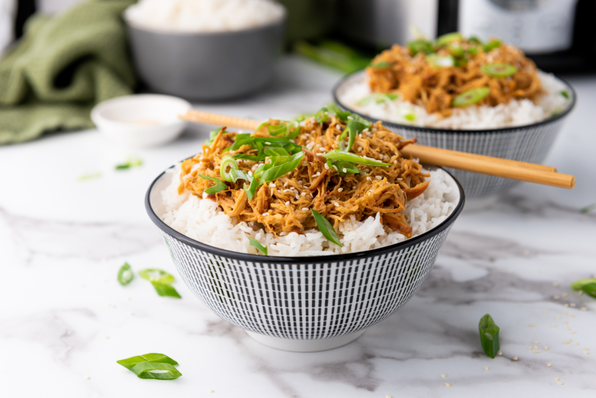 honey chicken over rice in pretty bowls