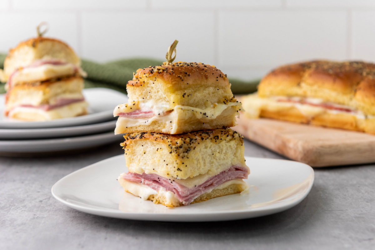 ham and cheese sliders on plate stacked