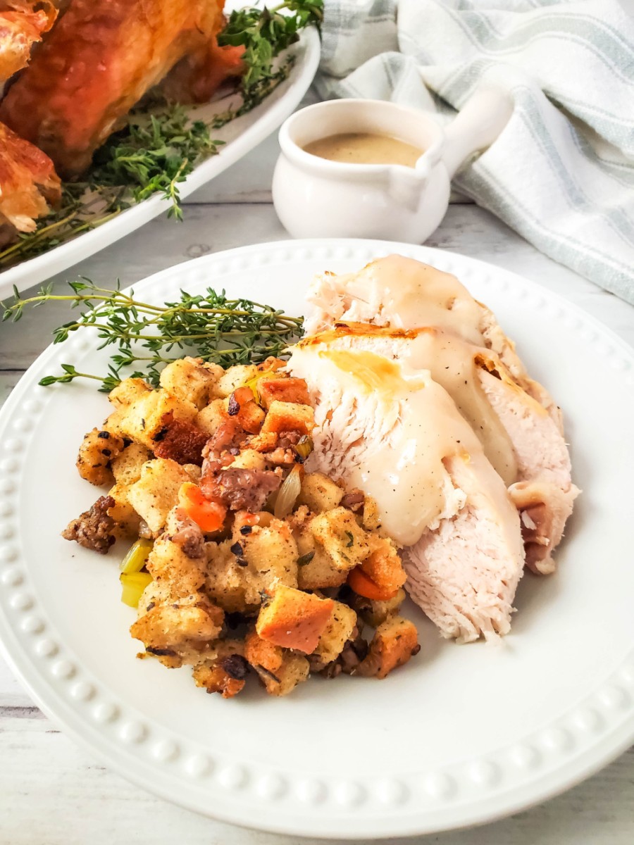 close up of roasted turkey with stuffing on plate