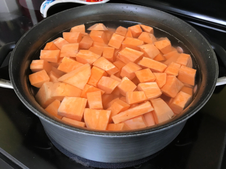 cut sweet potatoes in large pan of water
