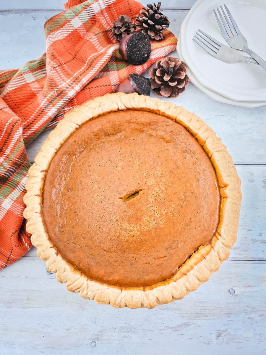 overhead view of homemade pie with pumpkin