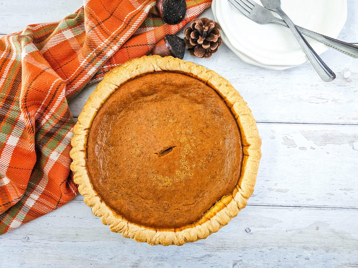 whole pumpkin pie image with fall decor