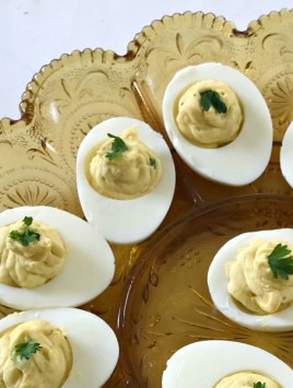 Classic Deviled Eggs are a must-have at most holidays, Easter, potlucks, and other gatherings. With just 5 main ingredients to the filling, deviled eggs are easy and quick to make. #deviledeggs #eggs