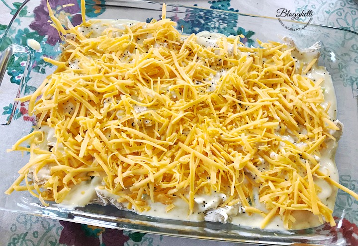 adding the cheese to the casserole dish