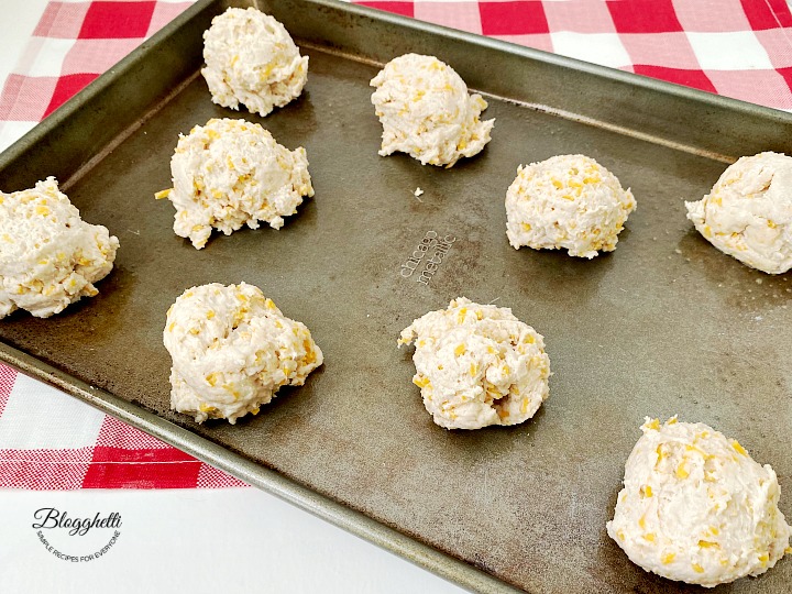 cheese biscuit dough on baking sheet