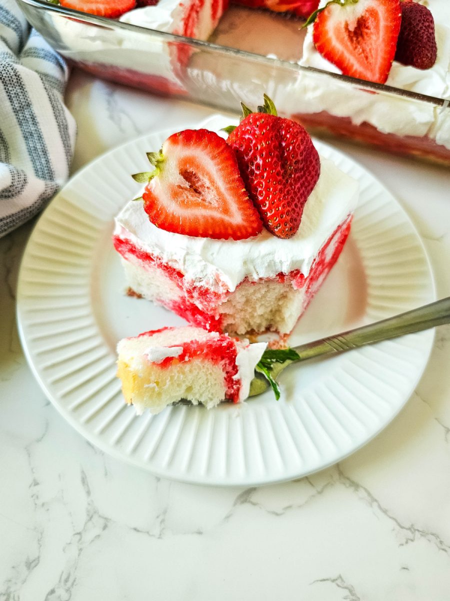 fork with bite of strawberry poke cake