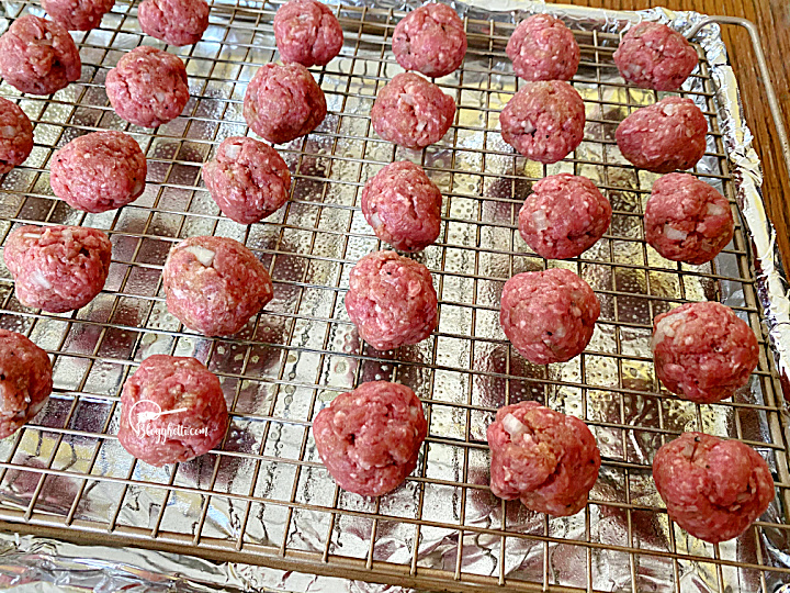 meatballs on baking rack ready to bake