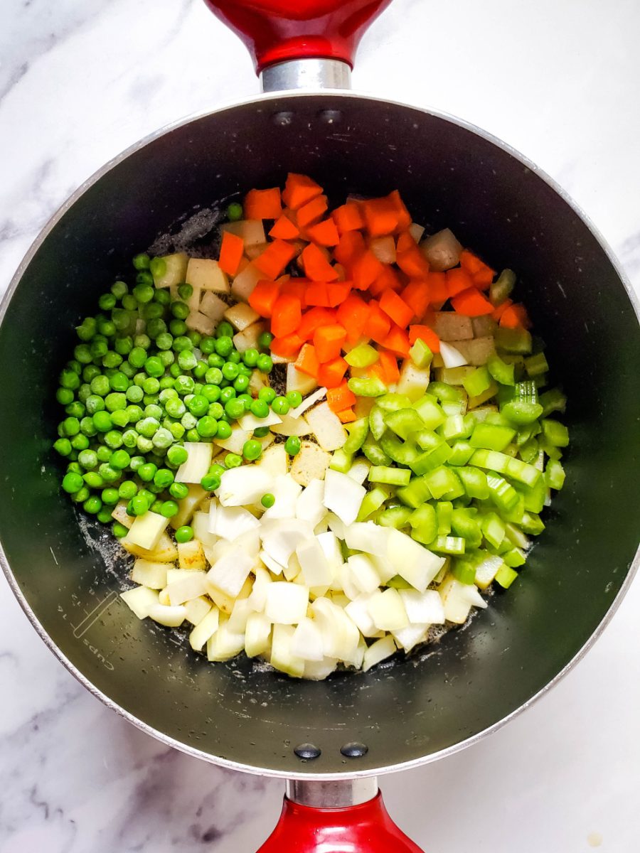 add in the carrots, peas, onions, and celery into pot