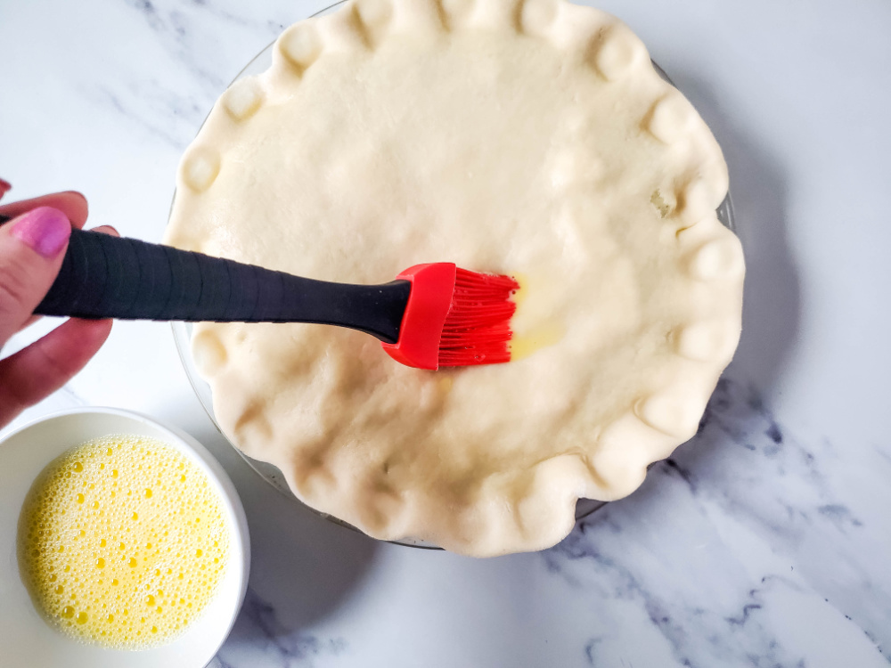 brush top of pie crust with egg wash