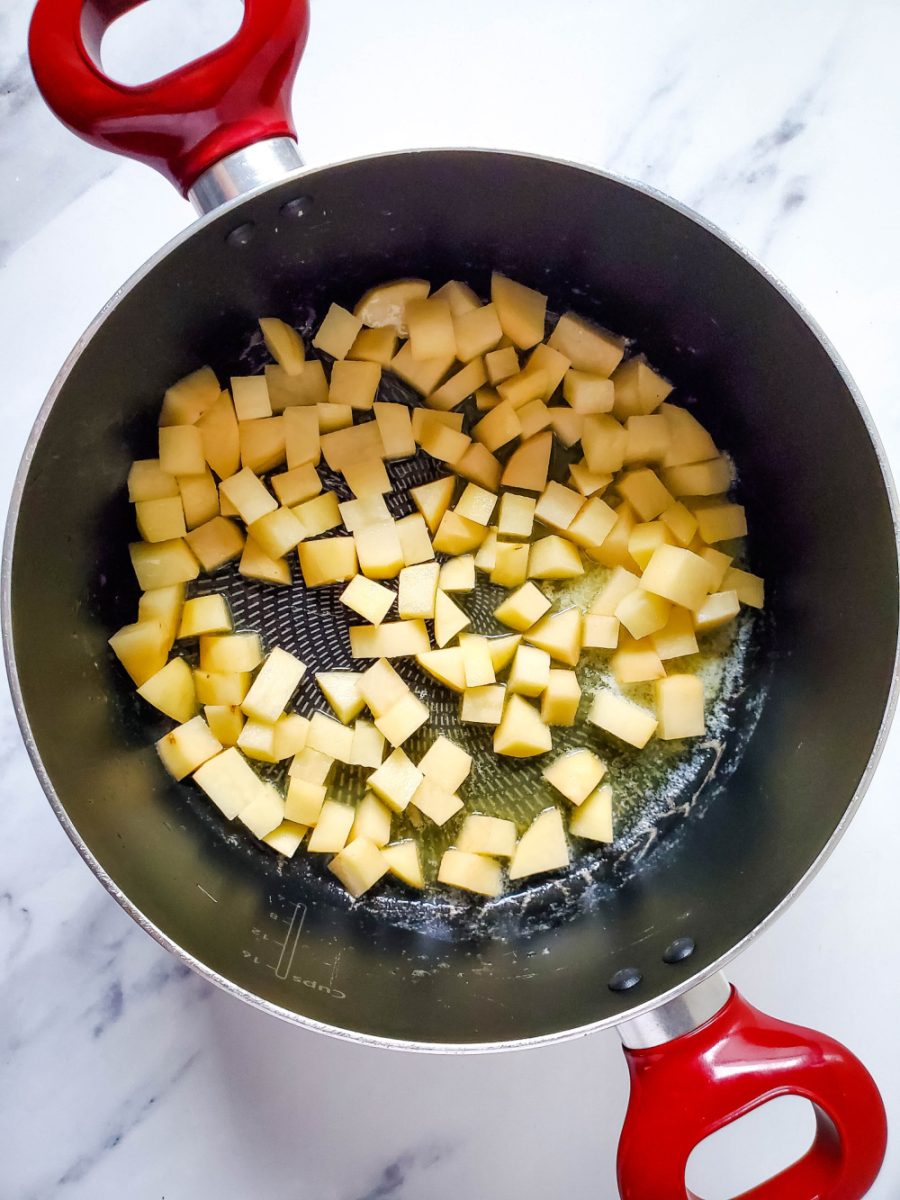 diced potatoes cooking in large pot