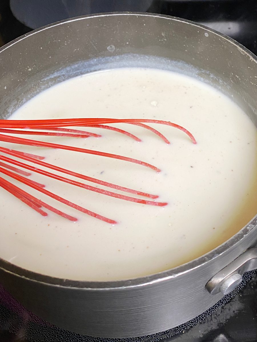 add milk to roux and allow to thicken