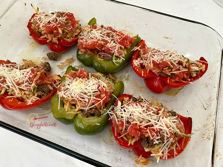 adding parmesan cheese to peppers