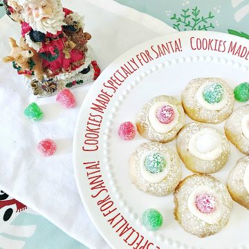 Sugar plum thumbprint cookies on Santa plate