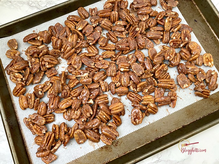 cinnamon sugar pecans on baking sheet ready to go into oven
