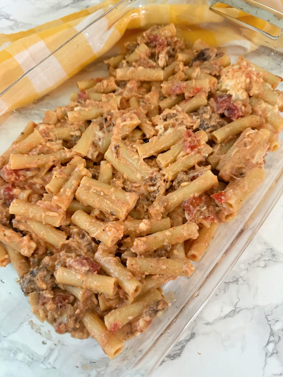 pour half of the pasta in baking dish