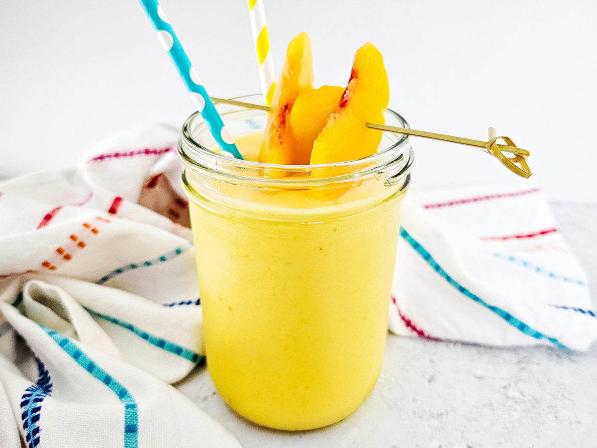 tropical smoothin in mason jar glass with straw
