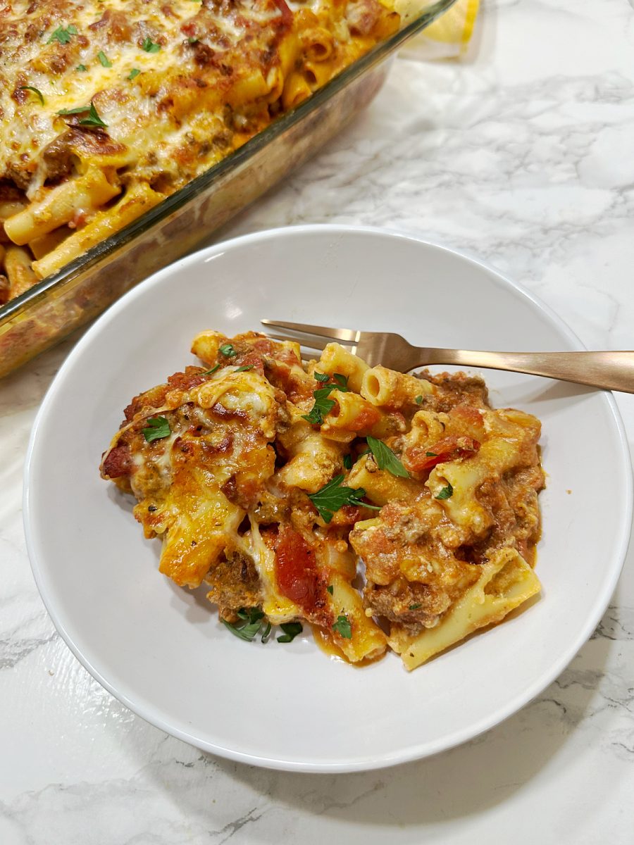 white bowl of pasta with meat sauce