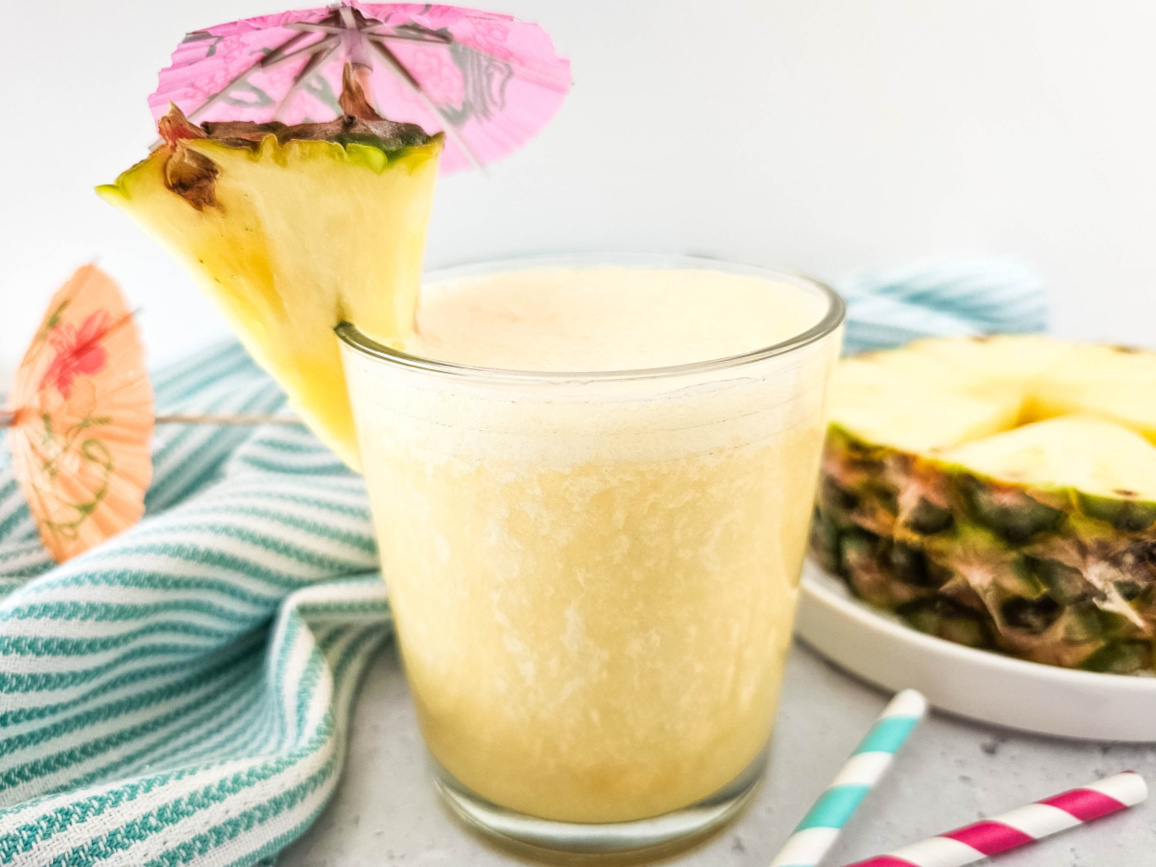 close up of pineapple smoothie with fresh pineapple