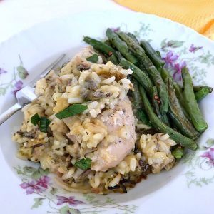 Creamy chicken and wild rice served with green beans on a plate