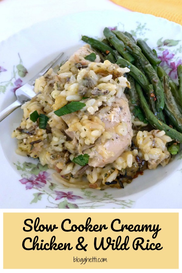 Creamy chicken and wild rice served with green beans on a plate