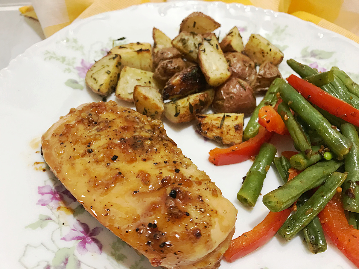 garlic chicken with roasted vegetables on plate