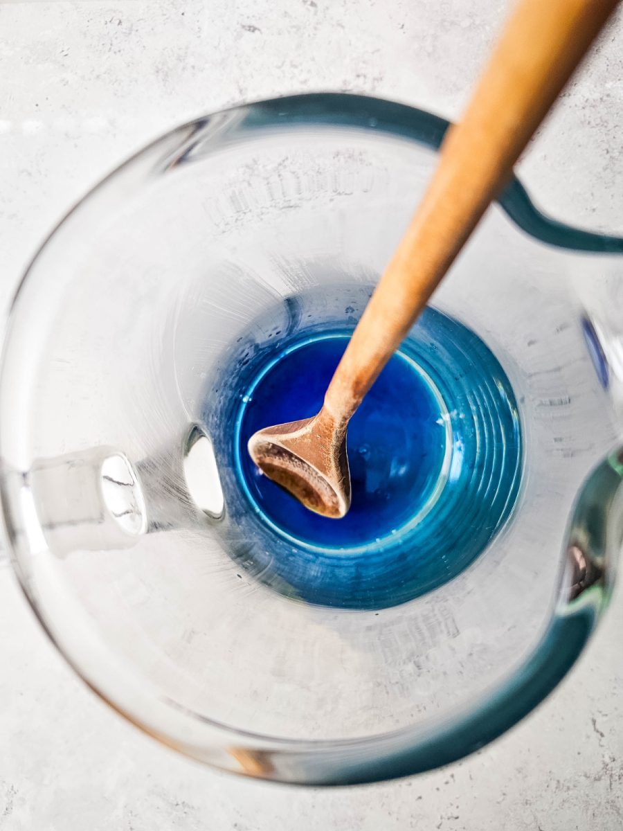 simple syrup and blue food coloring in pitcher