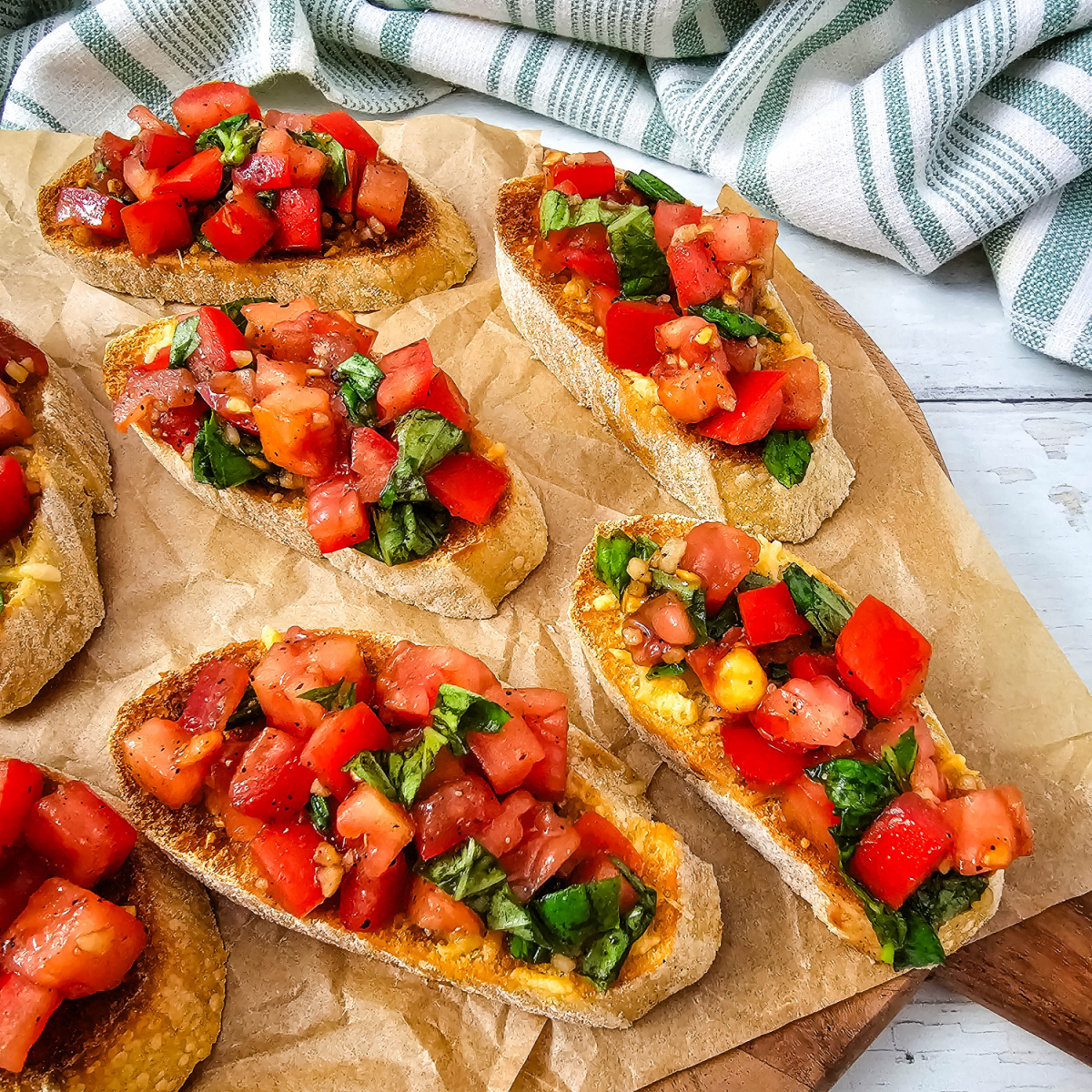Garden Fresh Bruschetta served on toasted Parmesan baguette slices with fresh tomatoes, basil, and balsamic.