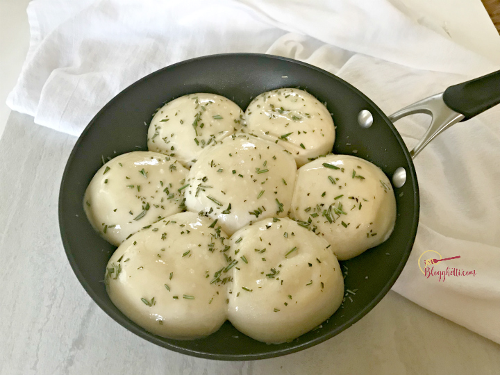 rosemary dinner rolls ready to bake in skillet