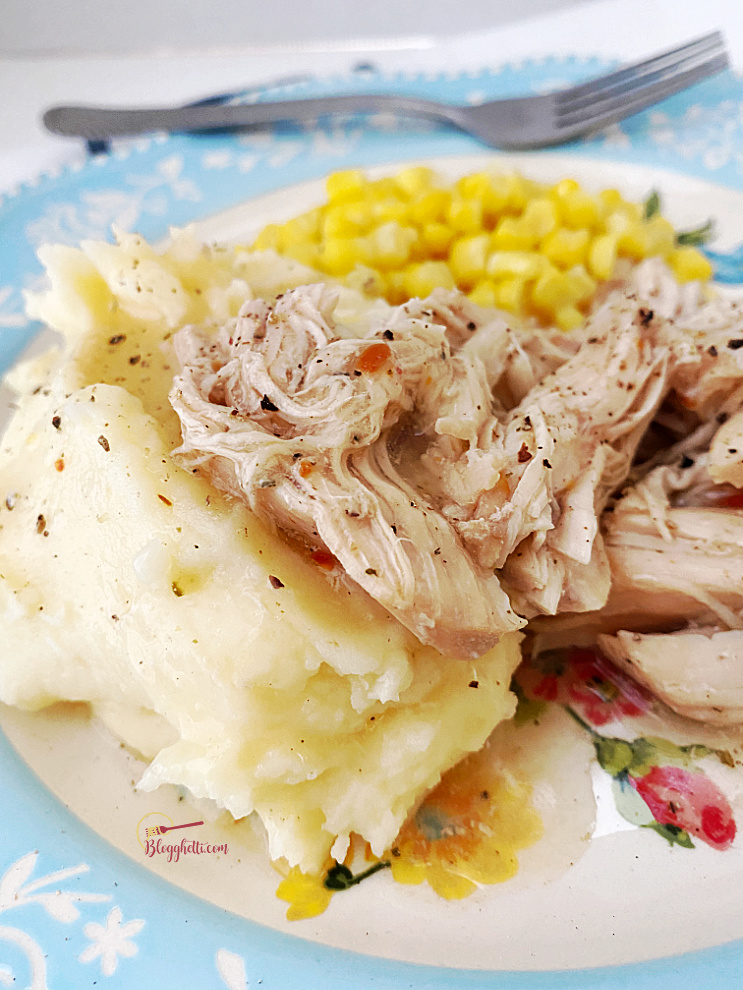 close up of Italian Chicken with mashed potatoes and corn