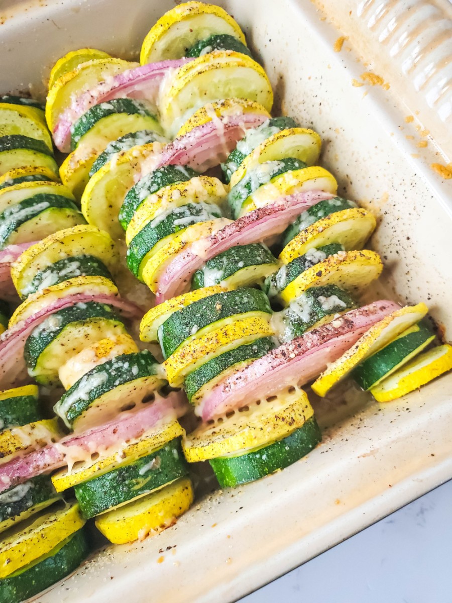 close up of casserole dish with zucchini and yellow squash baked