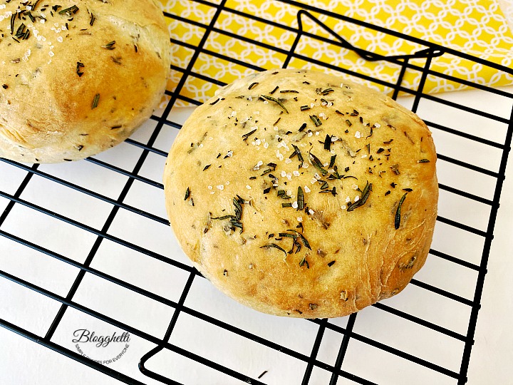 loaf of rosemary bread cooling