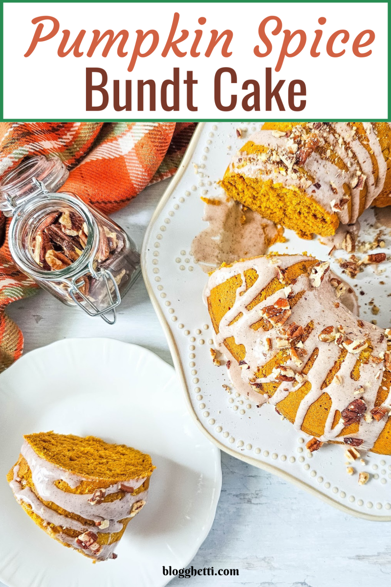 A top-down view of a delicious pumpkin spice bundt cake on a white plate. The cake is glazed and sprinkled with pecans, with a slice on a smaller plate beside it. A jar of pecans and a folded orange and black plaid napkin are in the background.