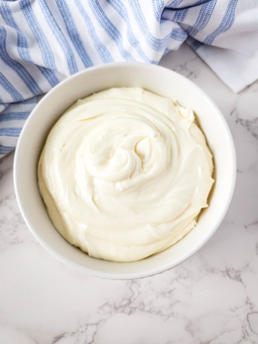 cream cheese icing in white bowl