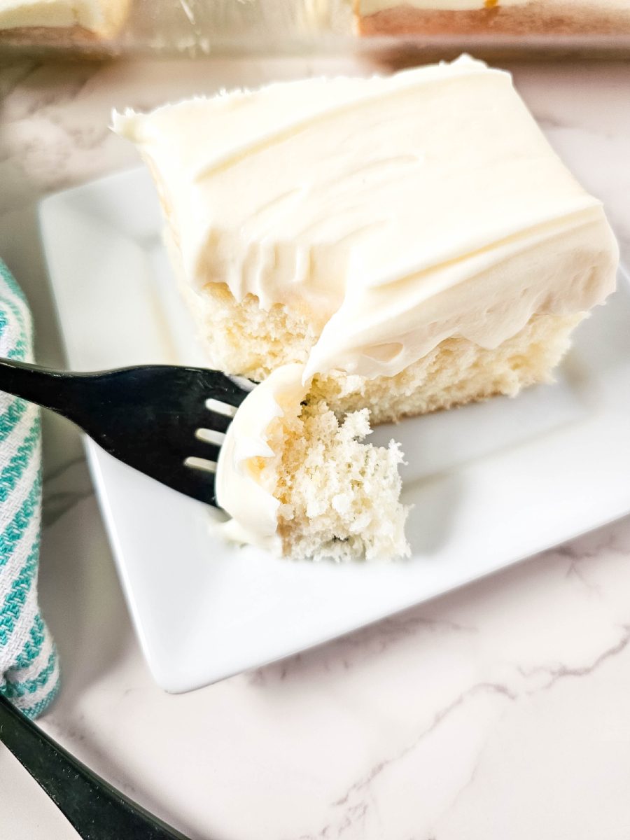 jazzed up white cake slice on serving plate with fork