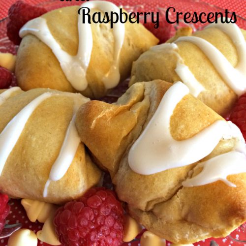 These White Chocolate and Raspberry Crescents are a sweet way bring a smile a special someone’s face. Flaky crescent rolls are filled with white chocolate and fresh raspberries, and baked till golden brown.