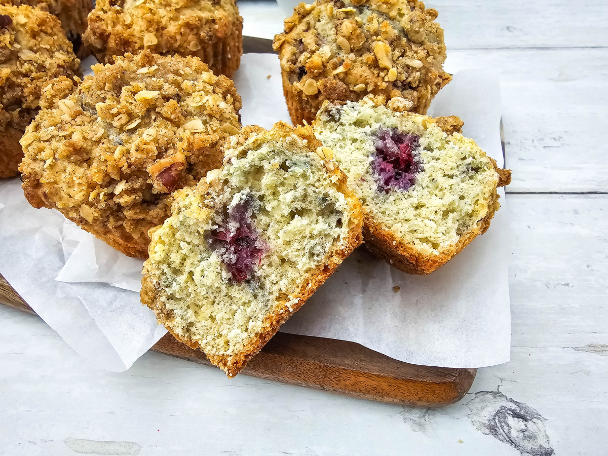 close up of cut muffin showing blackberries
