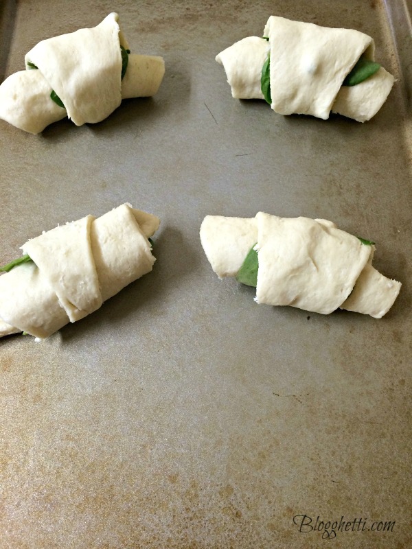 Light and fluffy crescents are loaded with cheese and spinach and make an easy appetizer or light lunch with a salad. #spinach #cheese #appetizer #crescents #meatlessmonday