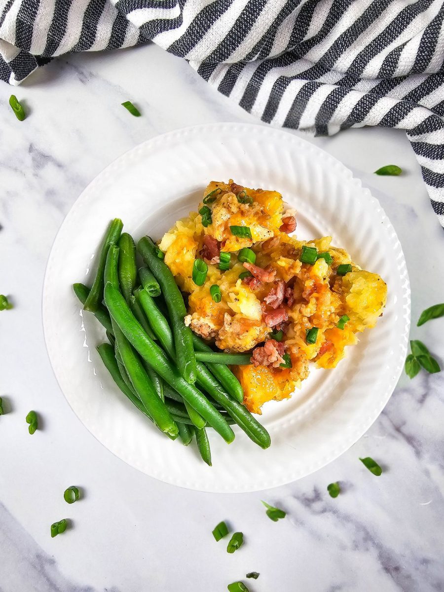 chicken potato bake with green beans on white plate