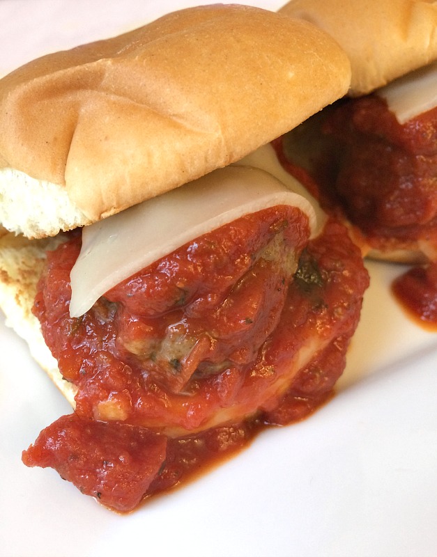 Easy Meatball Sliders are the answer to a quick weeknight dinner or game day food for a crowd. Great way to use up leftover marinara sauce and a bonus is you can freeze the meatballs and sauce for another meal. #meatballs #sliders #sandwiches