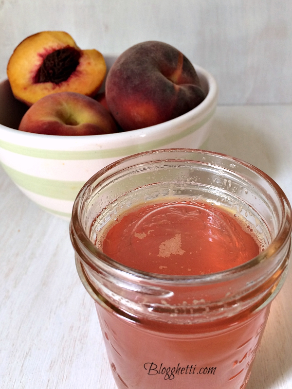mason jar with peach simple syrup