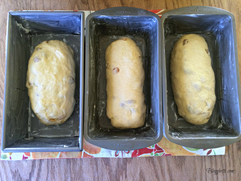 2nd rise of babka bread with dough in baking loaf pans
