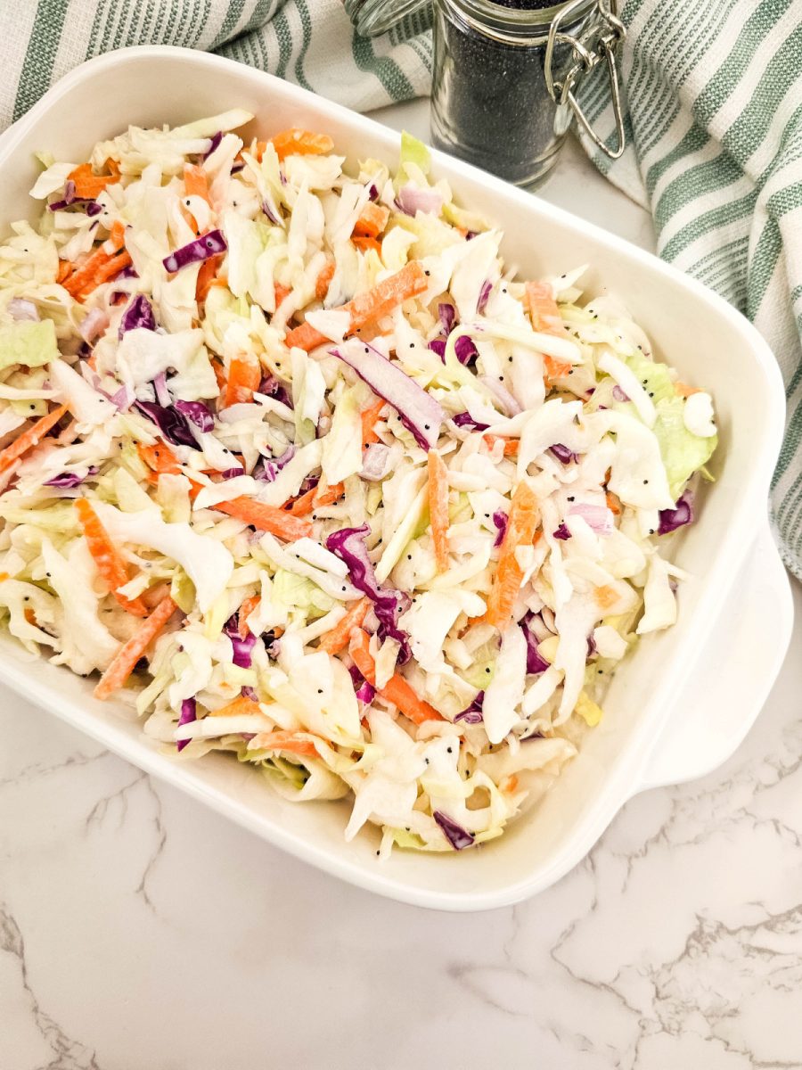 easy coleslaw made in white casserole dish