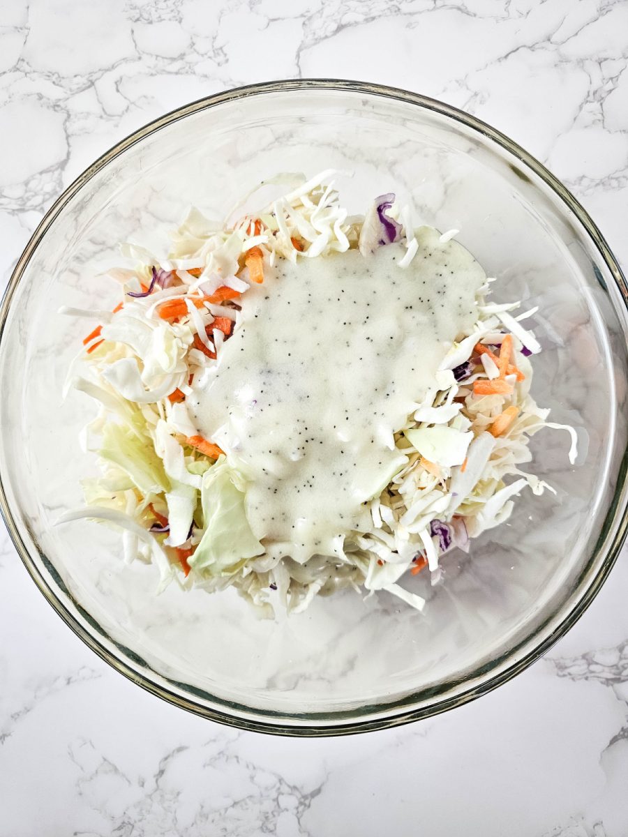 pour poppy seed dressing over coleslaw mix and combine