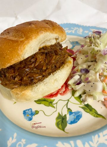BBQ beef sandwich with coleslaw on blue plate