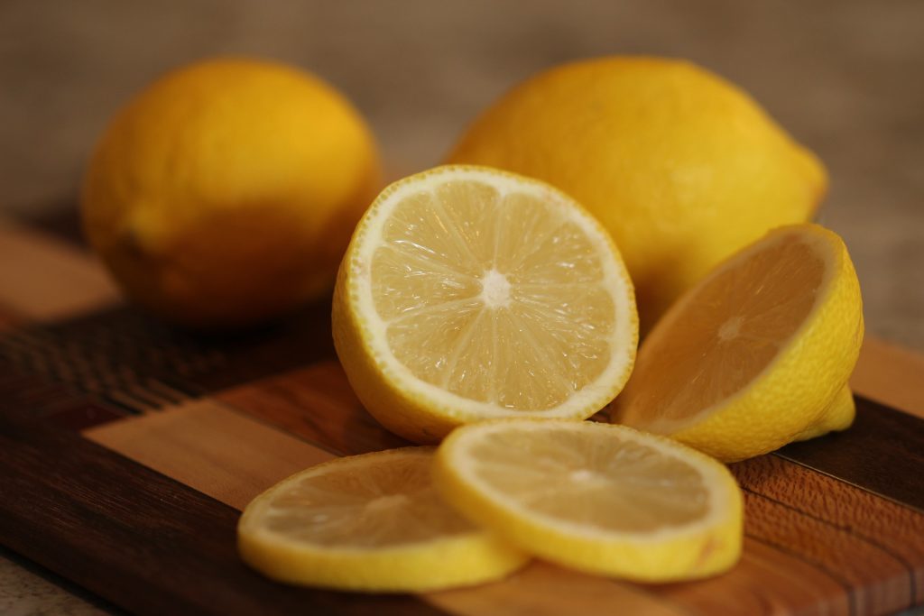 lemons with one lemon cut in half