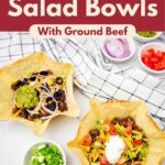 Two tortilla bowls filled with ground beef, lettuce, cheddar and toppings beneath a burgundy header. Text reads “Easy Taco Salad Bowls” and “With Ground Beef.”