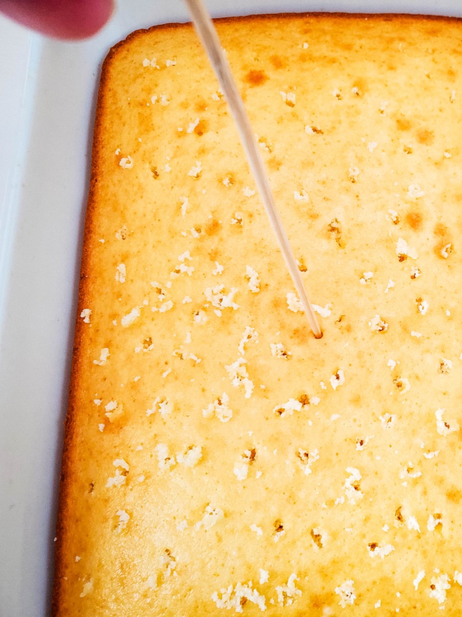 poke holes into cake with a wooden skewer
