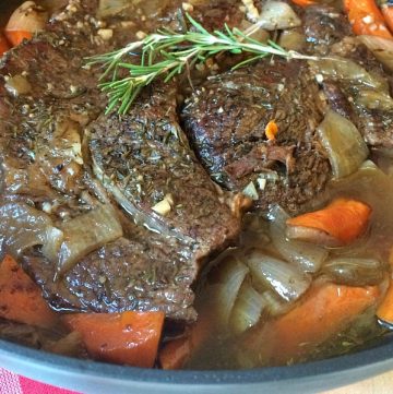 We call it melt in your mouth perfect oven pot roast for a reason. The meat is slow cooked in the oven with carrots and onions until the meat is fall-apart-tender and the carrots are tender crisp.