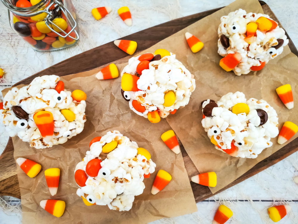cute halloween popcorncandy balls with extra candy on tray